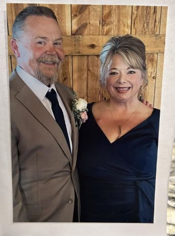 Theresa and Brian at Gretchen’s wedding, Theresa wearing her beloved navy dress